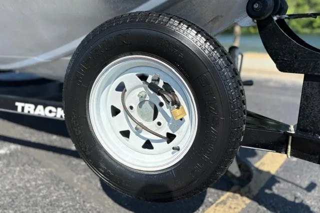Slide: The Image of Trailer wheel of 2012 TRACKER BOATS Pro Team 175, parked on asphalt. - 37