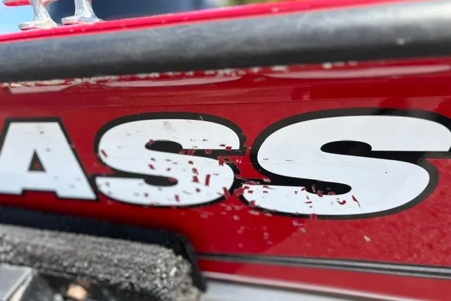 Slide: The Image of Close-up of red 2012 TRACKER BOATS Pro Team 175 with "BASS" decal. - 45