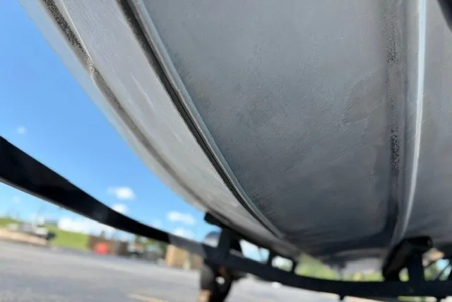 Slide: The Image of Close-up of 2012 TRACKER BOATS Pro Team 175 hull on trailer, under clear blue sky. - 40