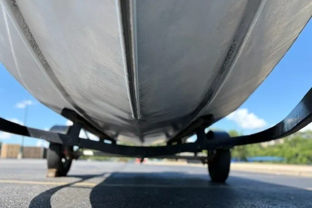 Slide: The Image of Underside view of a 2012 TRACKER BOATS Pro Team 175 on a trailer. - 39