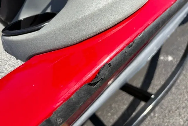 Slide: The Image of Damaged red hull of 2012 TRACKER BOATS Pro Team 175. - 57