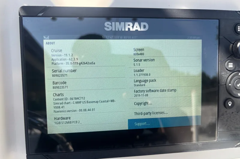 Slide: The Image of Simrad display showing software details on a 2010 Sea Hunt Ultra 210 boat. - 14