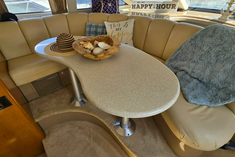 Slide: The Image of Luxurious interior of 2002 Carver 410 Sport Sedan with elegant seating and decor. - 10