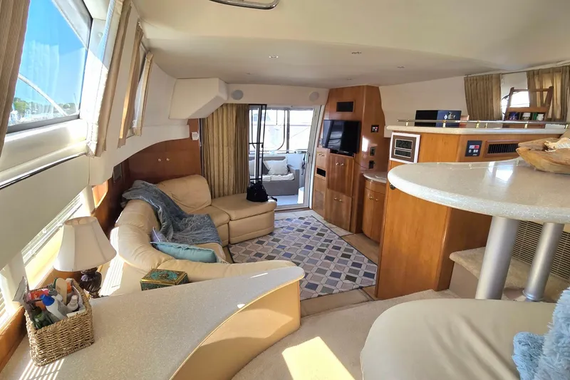 Slide: The Image of Luxurious interior of 2002 Carver 410 Sport Sedan yacht with cozy seating and modern amenities. - 33