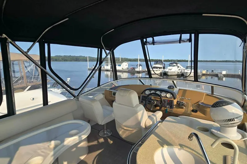 Slide: The Image of Interior view of 2002 Carver 410 Sport Sedan yacht at marina. - 22