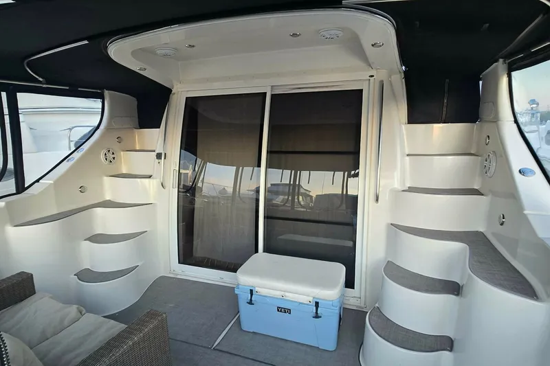 Slide: The Image of 2002 Carver 410 Sport Sedan yacht interior with stairs and seating area. - 32