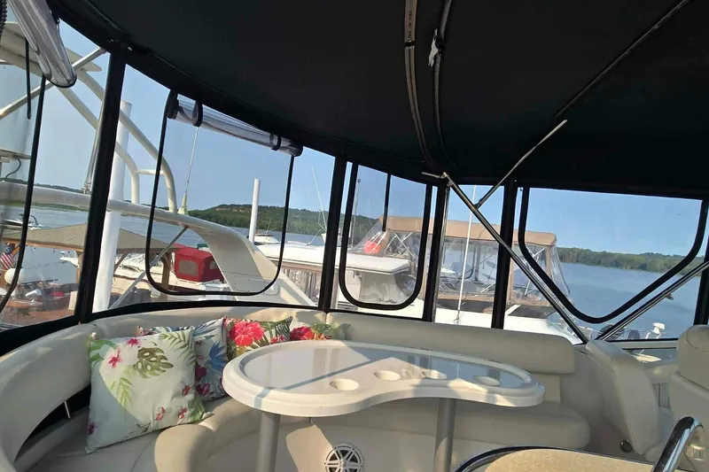Slide: The Image of Interior view of 2002 Carver 410 Sport Sedan yacht with seating and lake backdrop. - 23