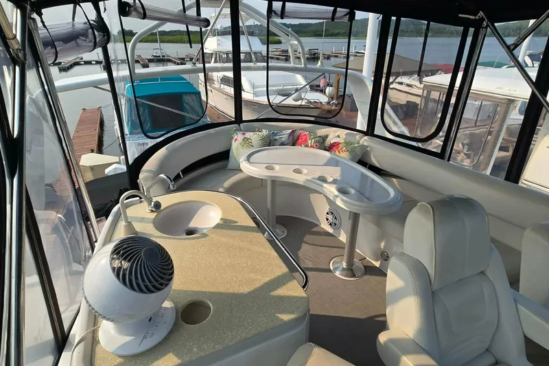 Slide: The Image of Luxurious interior of a 2002 Carver 410 Sport Sedan yacht with seating and amenities. - 20