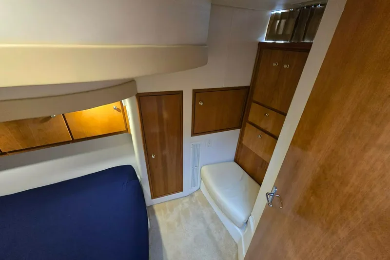 Slide: The Image of Interior cabin of 2002 Carver 410 Sport Sedan with wood cabinetry and seating. - 16
