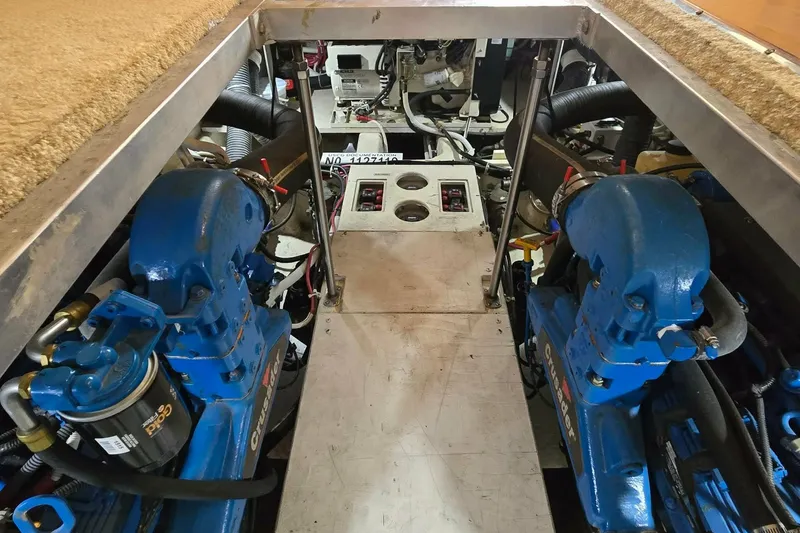 Slide: The Image of Engine room of a 2002 Carver 410 Sport Sedan with twin blue Crusader engines. - 26