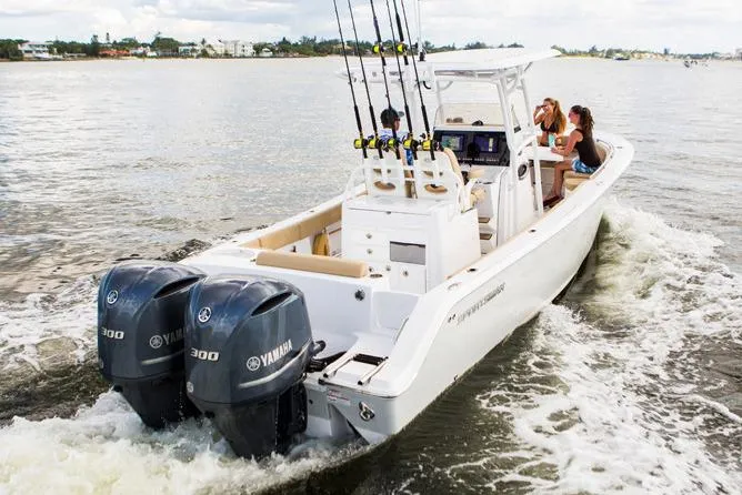 Slide: The Image of Manufacturer Provided Image: 2017 Sportsman Open 282 Center Console boat with twin Yamaha 300 engines on water. - 5