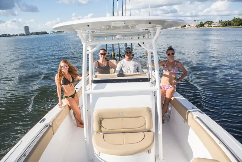 Slide: The Image of Manufacturer Provided Image: 2017 Sportsman Open 282 Center Console boat with people enjoying a sunny day on the water. - 8