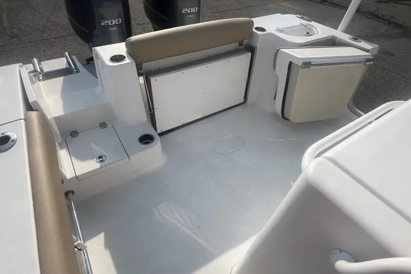Slide: The Image of 2017 Sportsman Open 282 Center Console boat interior with seating and storage compartments. - 22