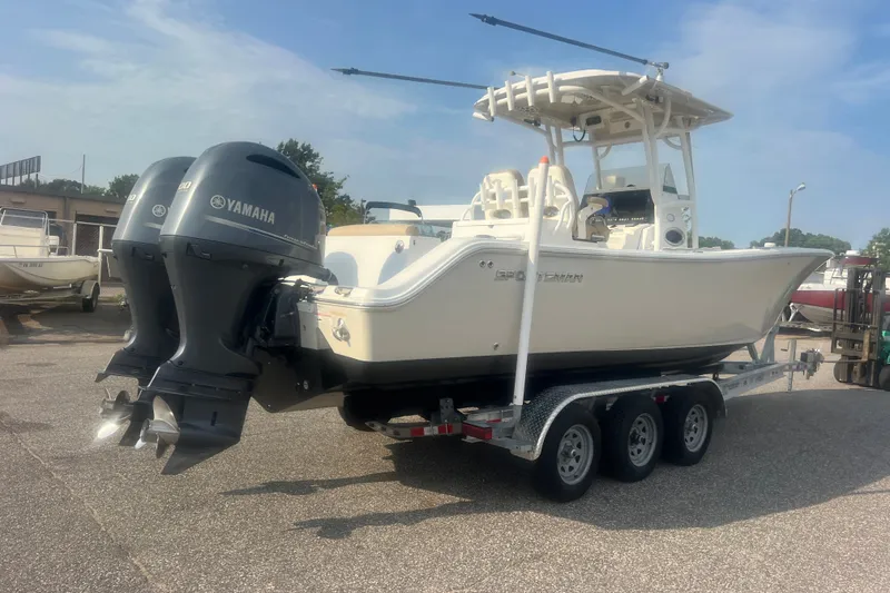 Slide: The Image of 2017 Sportsman Open 282 Center Console boat on trailer with twin Yamaha engines. - 1