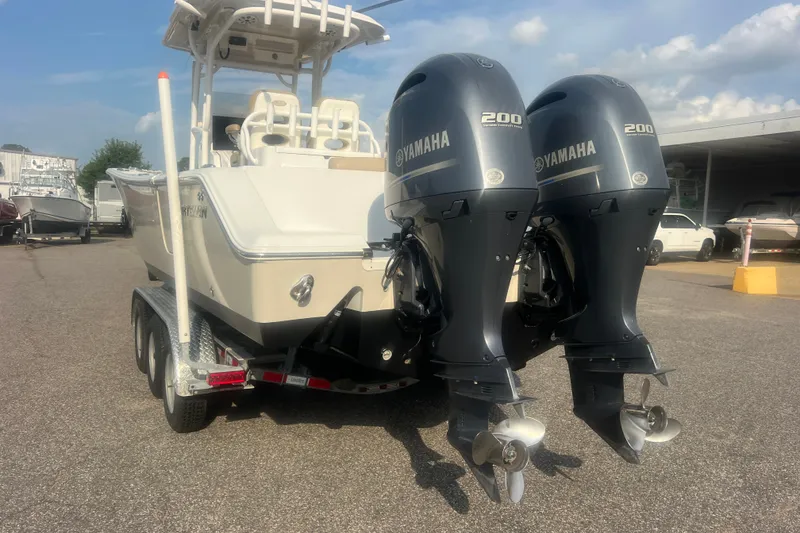 Slide: The Image of 2017 Sportsman Open 282 Center Console boat with twin Yamaha 200 engines on a trailer. - 15