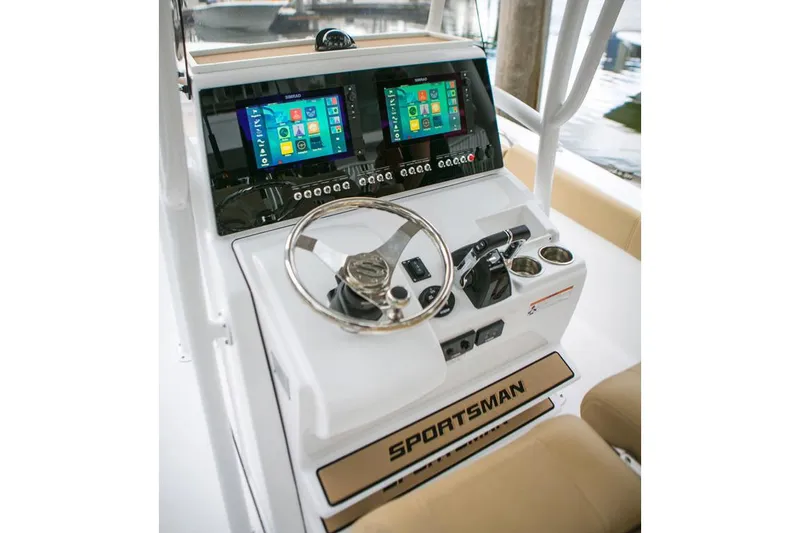 Slide: The Image of Manufacturer Provided Image: 2017 Sportsman Open 282 Center Console boat dashboard with dual screens and steering wheel. - 9