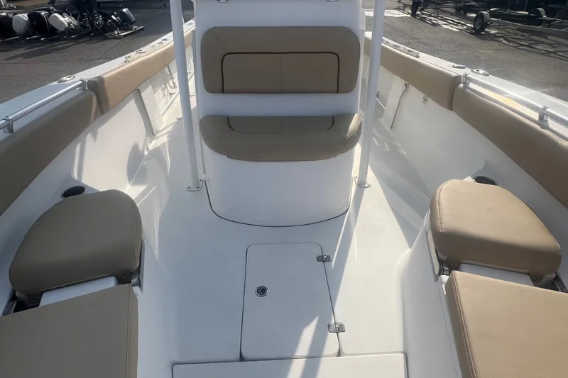 Slide: The Image of 2017 Sportsman Open 282 Center Console boat interior with beige seating. - 21