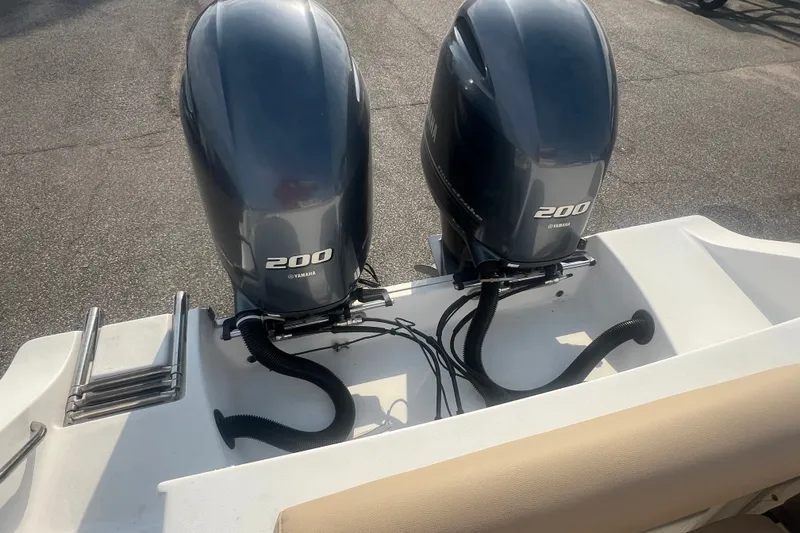 Slide: The Image of Twin Yamaha 200 engines on a 2017 Sportsman Open 282 Center Console boat. - 24