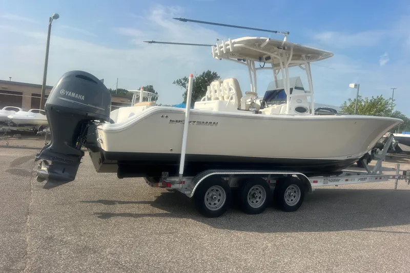 Slide: The Image of 2017 Sportsman Open 282 Center Console boat on trailer, featuring Yamaha outboard motor. - 13