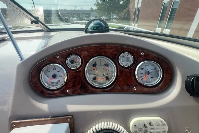 Slide: The Image of Dashboard of a 2004 Rinker 282 Captiva Bowrider with gauges and controls. - 22