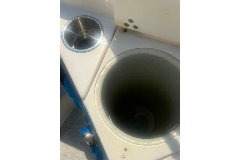 Slide: The Image of Cup holder and compartment on 2004 Rinker 282 Captiva Bowrider boat. - 52