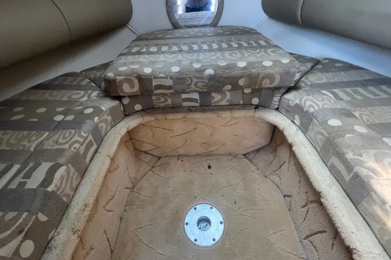 Slide: The Image of Interior of 2004 Rinker 282 Captiva Bowrider with patterned seating and carpeted floor. - 32