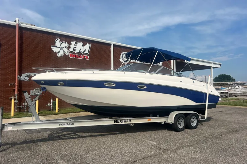 The Image of 2004 Rinker 282 Captiva Bowrider on trailer outside HM Boats building. - 1