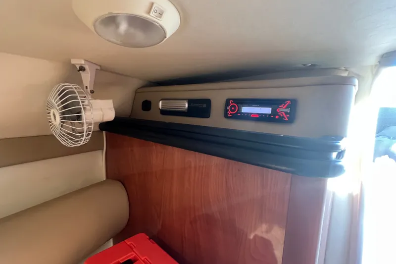Slide: The Image of Interior of 2004 Rinker 282 Captiva Bowrider with fan and stereo system. - 29