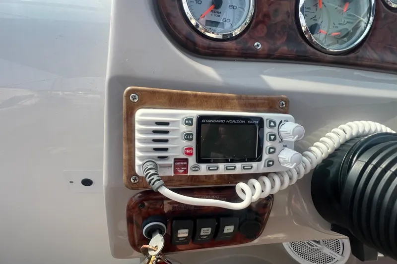 Slide: The Image of 2004 Rinker 282 Captiva Bowrider dashboard with Standard Horizon Eclipse radio. - 23
