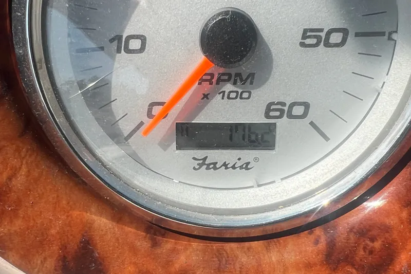 Slide: The Image of Tachometer of 2004 Rinker 282 Captiva Bowrider showing RPM and hours. - 51