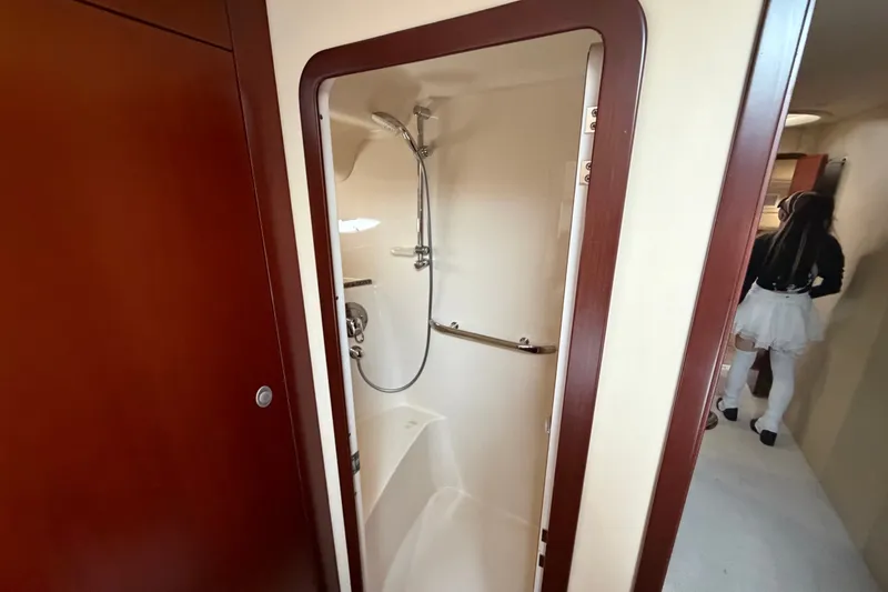 Slide: The Image of Shower area inside 2006 Sea Ray 550 Sedan Bridge yacht, featuring sleek design and wood accents. - 135