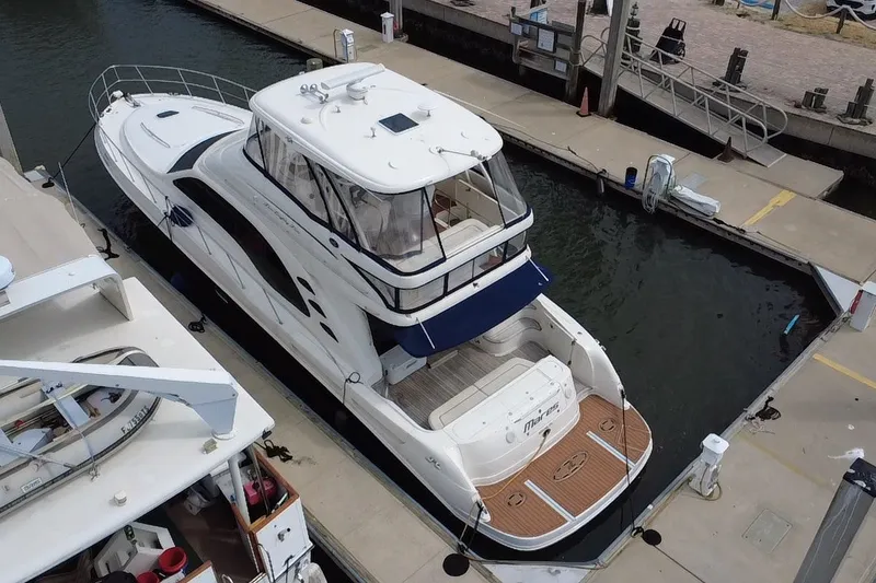 Slide: The Image of 2006 Sea Ray 550 Sedan Bridge yacht docked at marina, aerial view. - 6