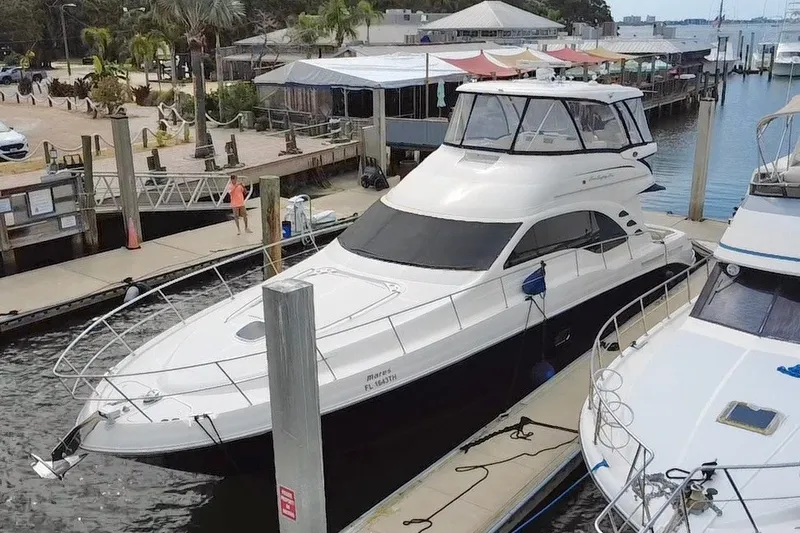 Slide: The Image of 2006 Sea Ray 550 Sedan Bridge yacht docked at marina. - 7