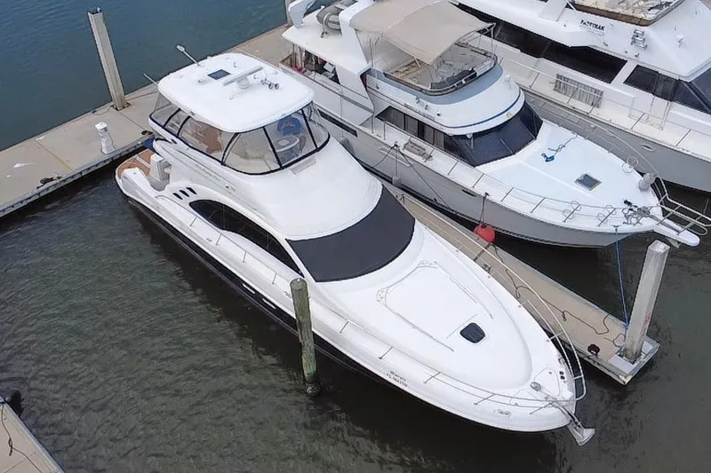 Slide: The Image of 2006 Sea Ray 550 Sedan Bridge yacht docked at marina, aerial view. - 1