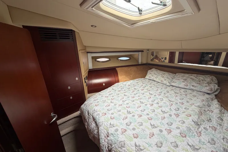 Slide: The Image of Luxurious bedroom interior of 2006 Sea Ray 550 Sedan Bridge yacht. - 130