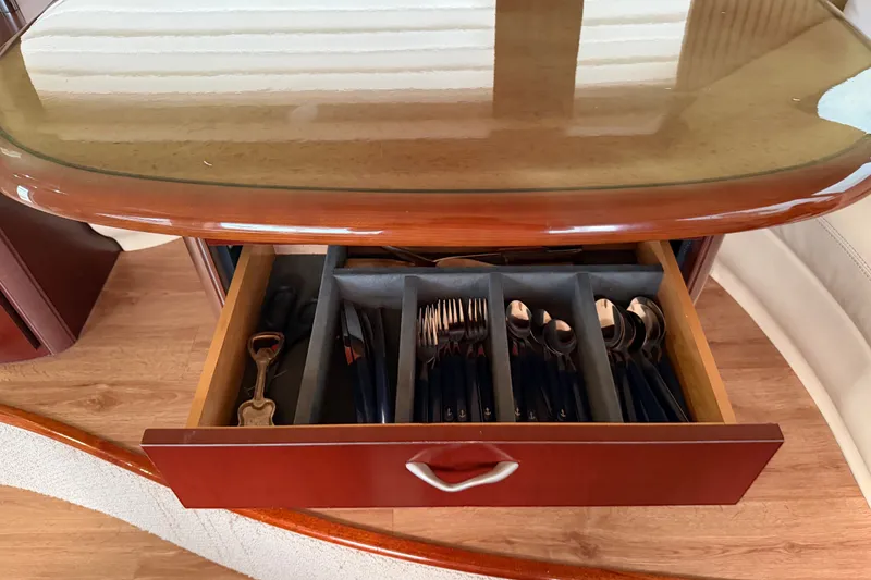 Slide: The Image of Open drawer with organized cutlery on a 2006 Sea Ray 550 Sedan Bridge yacht. - 111