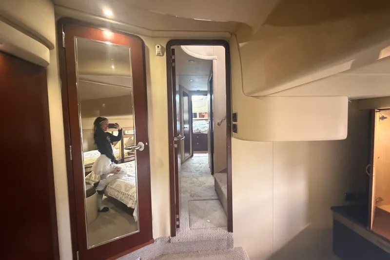 Slide: The Image of Interior of 2006 Sea Ray 550 Sedan Bridge yacht with mirrored door and cozy cabin. - 94