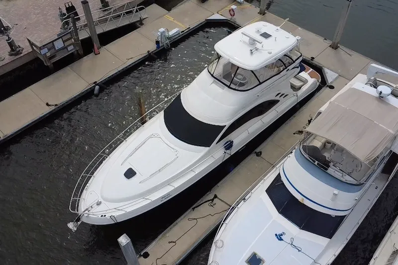 Slide: The Image of 2006 Sea Ray 550 Sedan Bridge yacht docked at marina, aerial view. - 13
