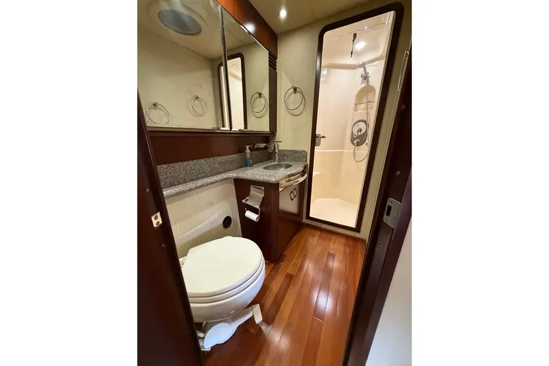 Slide: The Image of Luxurious bathroom in 2006 Sea Ray 550 Sedan Bridge yacht with wood flooring and modern fixtures. - 115