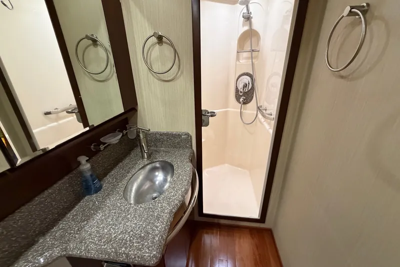 Slide: The Image of Luxurious bathroom in 2006 Sea Ray 550 Sedan Bridge yacht with modern fixtures. - 121
