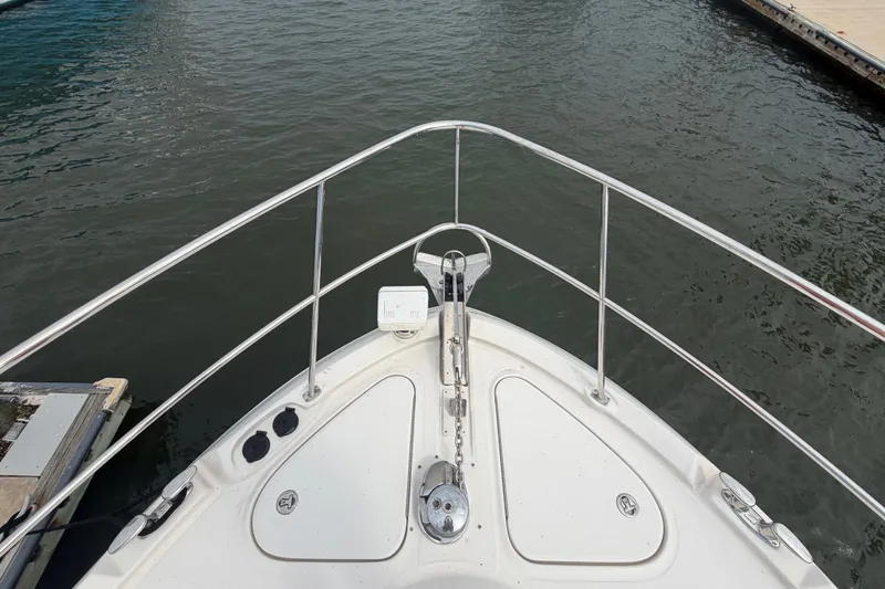 Slide: The Image of Bow view of 2006 Sea Ray 550 Sedan Bridge yacht at dock. - 38