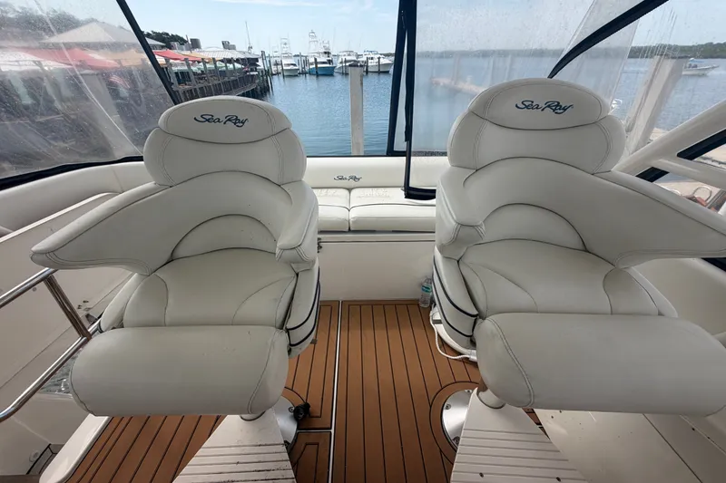 Slide: The Image of Luxury seating on 2006 Sea Ray 550 Sedan Bridge yacht, overlooking marina. - 54
