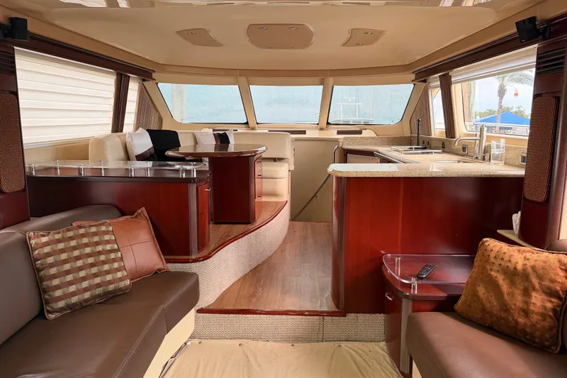 Slide: The Image of Luxurious interior of a 2006 Sea Ray 550 Sedan Bridge yacht with elegant furnishings. - 107