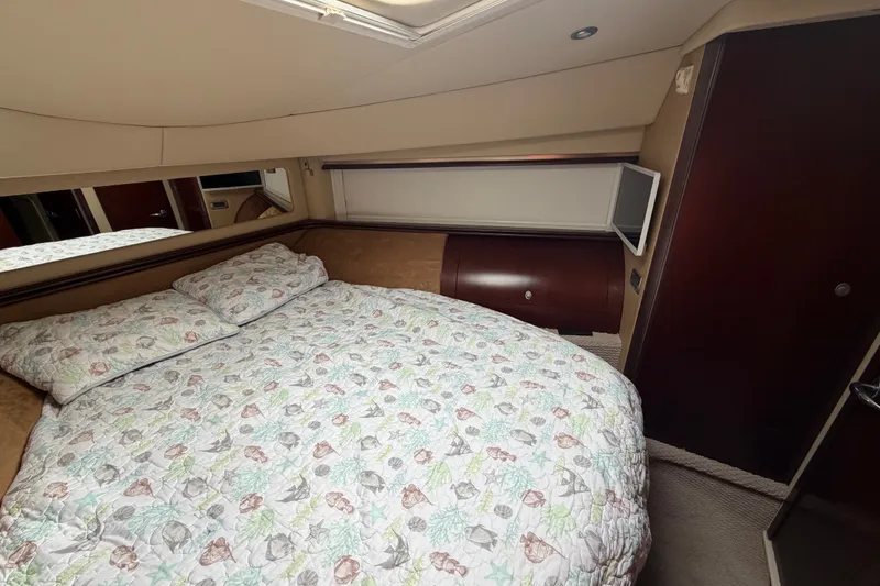 Slide: The Image of Luxurious bedroom interior of 2006 Sea Ray 550 Sedan Bridge yacht. - 131