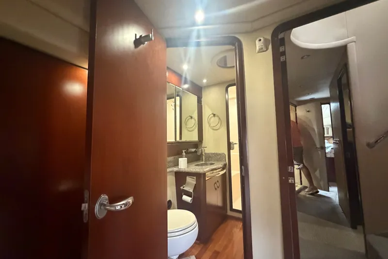 Slide: The Image of Interior of 2006 Sea Ray 550 Sedan Bridge yacht bathroom with wood accents and modern fixtures. - 81