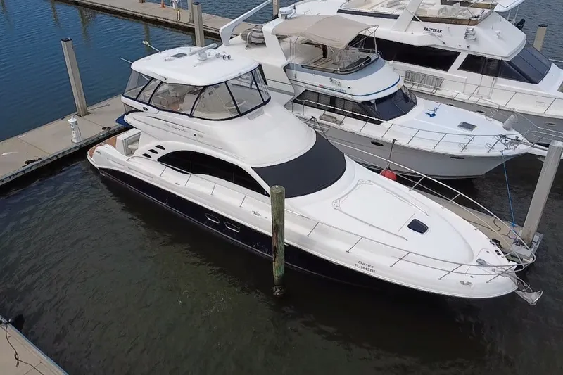 Slide: The Image of 2006 Sea Ray 550 Sedan Bridge yacht docked at marina, aerial view. - 14
