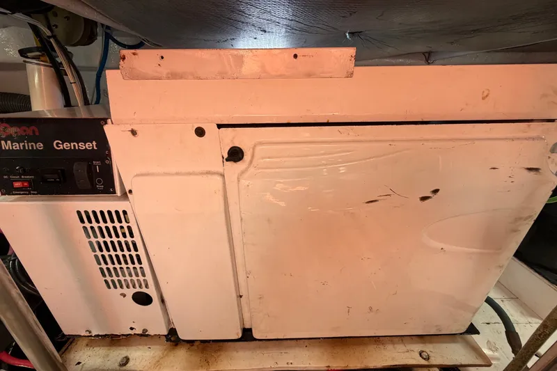 Slide: The Image of Marine generator inside a 2006 Sea Ray 550 Sedan Bridge yacht engine room. - 141