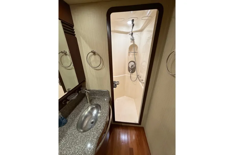 Slide: The Image of Luxurious bathroom in 2006 Sea Ray 550 Sedan Bridge yacht with shower and sink. - 116