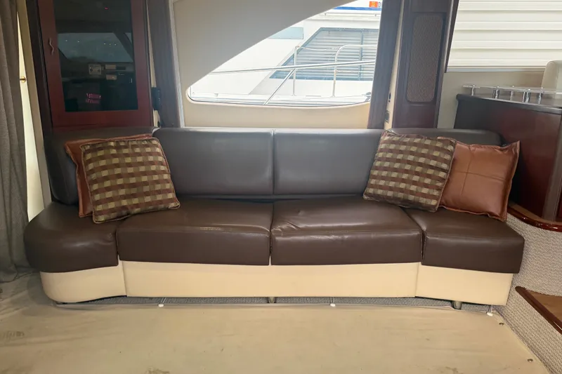 Slide: The Image of Luxurious leather seating in 2006 Sea Ray 550 Sedan Bridge yacht interior. - 64