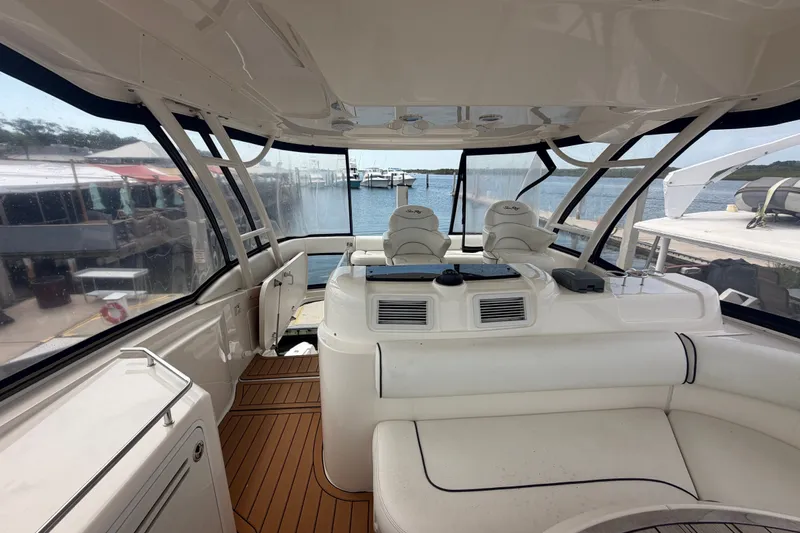 Slide: The Image of Interior view of a 2006 Sea Ray 550 Sedan Bridge yacht with spacious seating and helm. - 58